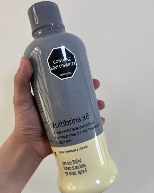 Botella de Multibrina de 1 litro en la mano