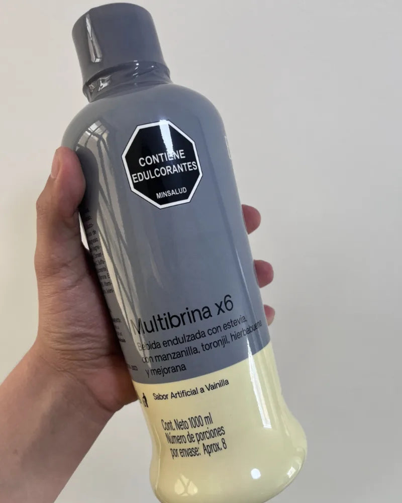 Botella de Multibrina de 1 litro en la mano